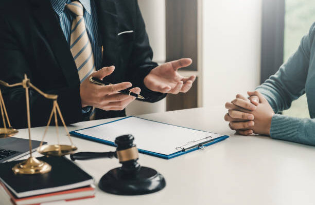 Image lawyer businessman sitting at the office with a woman customer explaining the agreement of advice.