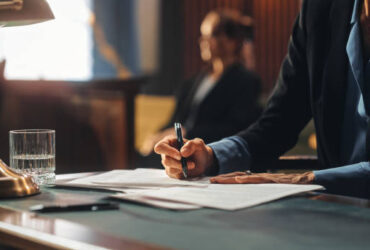 Court of Justice and Law Trial: Female Public Defender Writes Down Arguments for Defence Strategy. Successful Attorney Lawyer Fight for Freedom of Her Client with Supporting Evidence. Close Up.