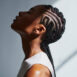 side profile shot of a beautiful black woman with cornrow braids, stock photo